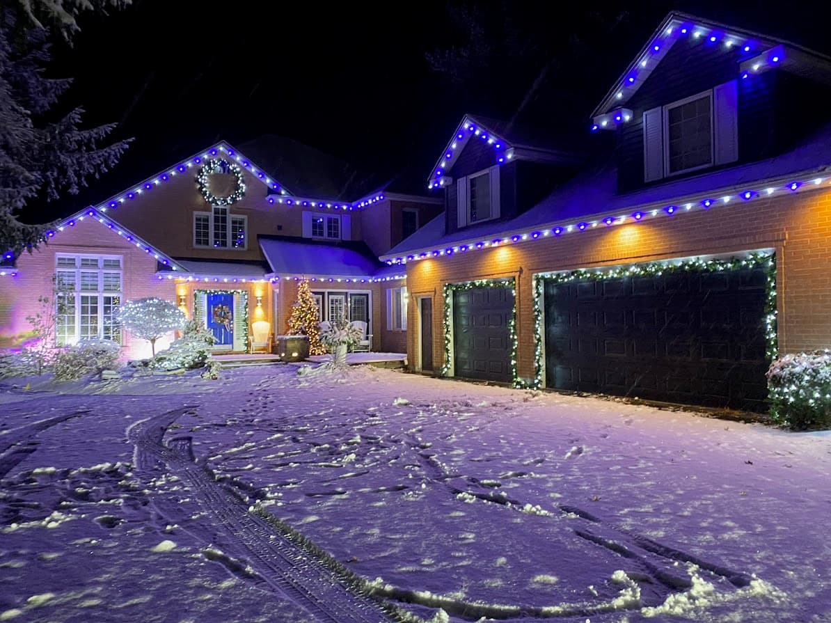 Christmas light installation in London, Ontario — professional roofline and tree lighting by We Install Christmas Lights